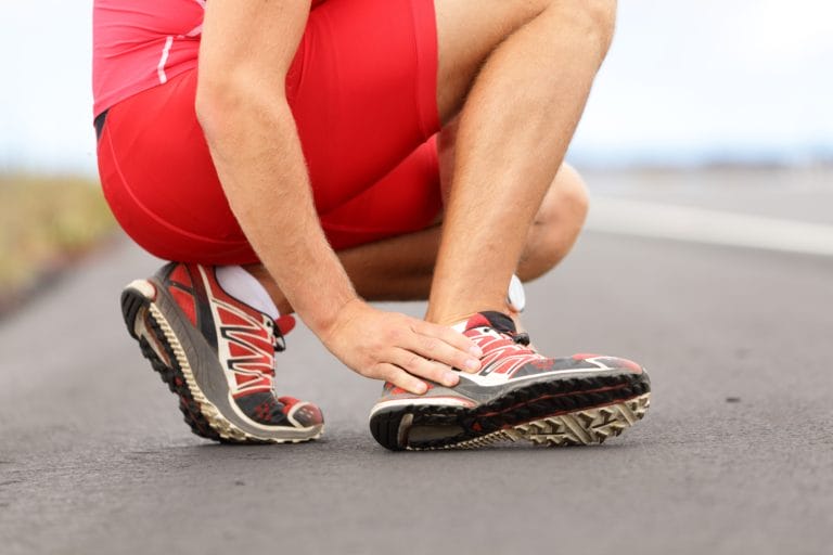 Picture of runner grabbing his foot