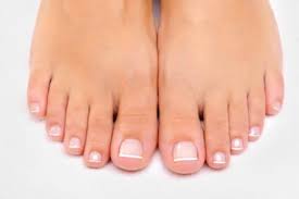 Picture of feet with white nail polish