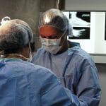 photograph of Dr Tsatsos performing surgery at anklenfoot center