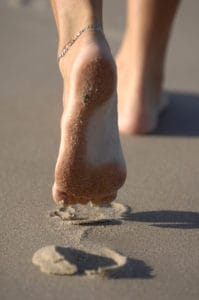 picture of feet leaving Foot prints in the sand