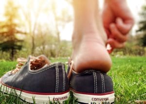 photograph ball of foot on top of shoe in grass